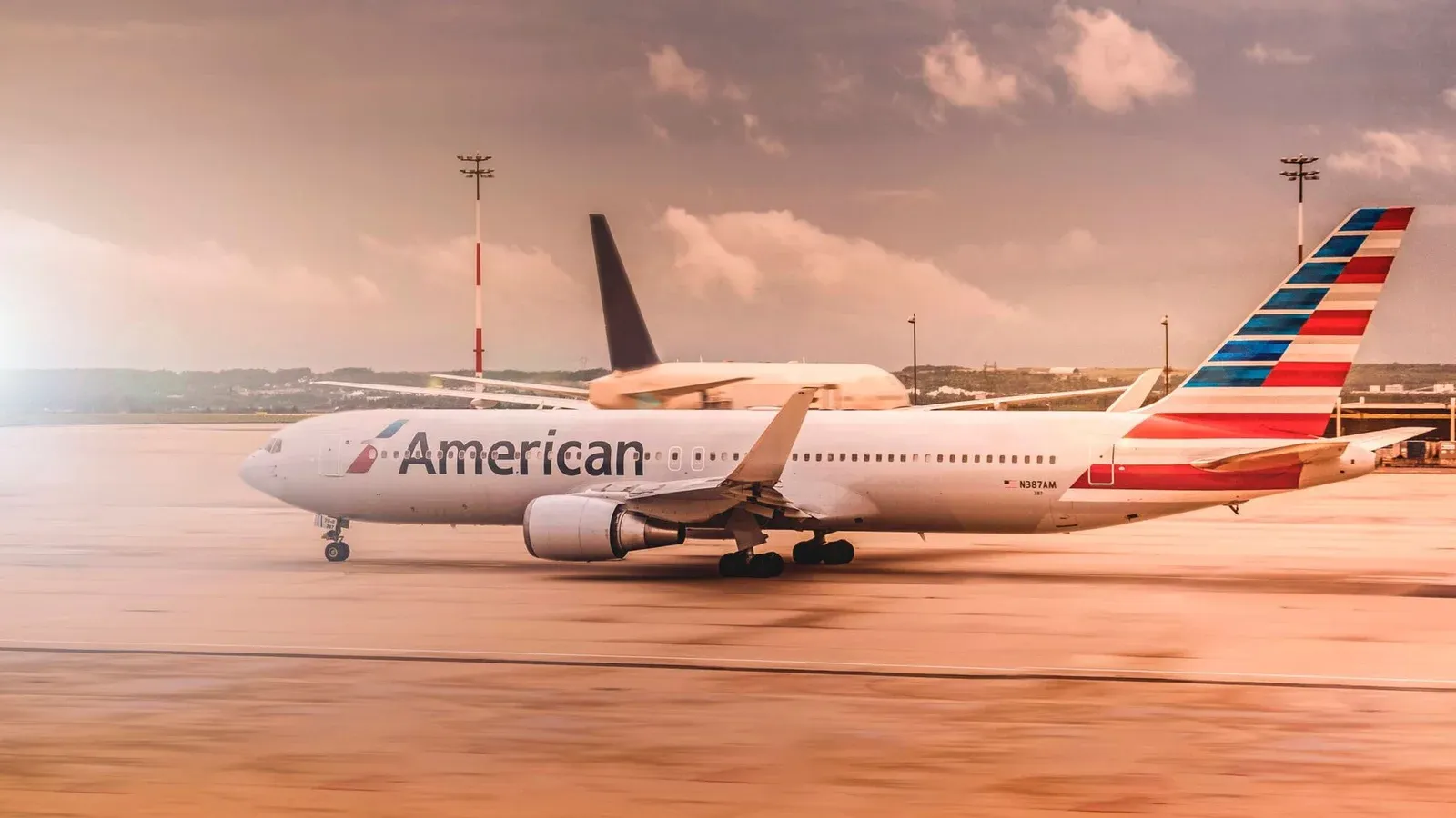 American Airlines aircraft on the runway at Paris Charles de Gaulle Airport during daylight.