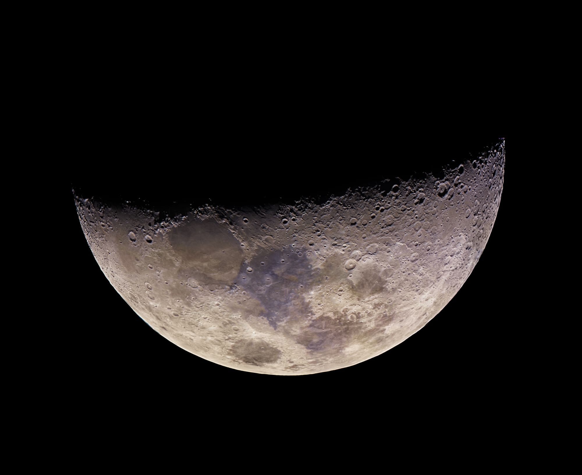 A detailed photograph capturing the craters and texture of the moon's surface.