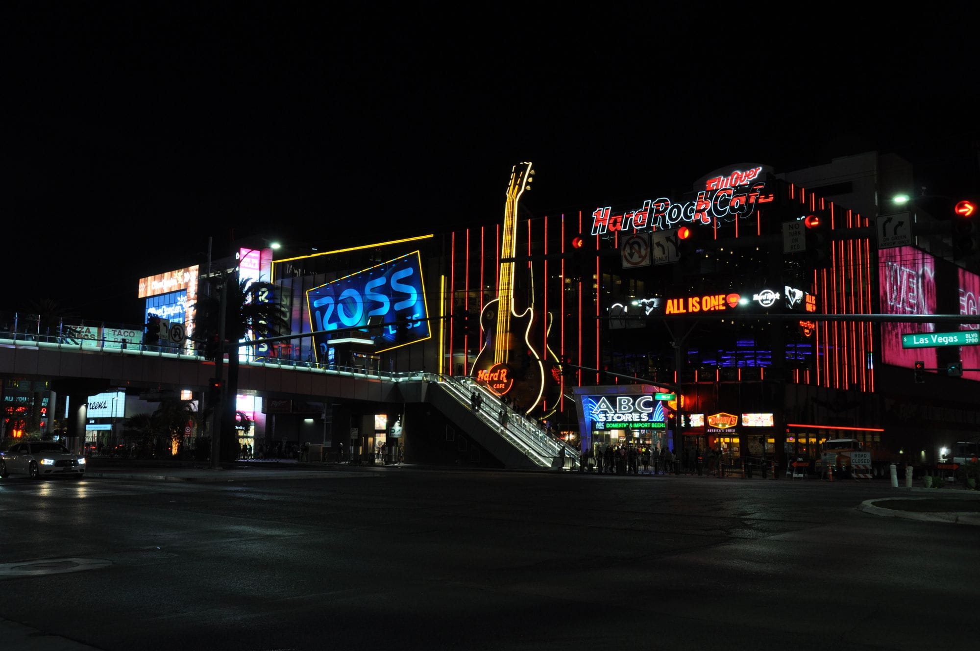 Night view of the vibrant Las Vegas Strip with neon lights and iconic landmarks.