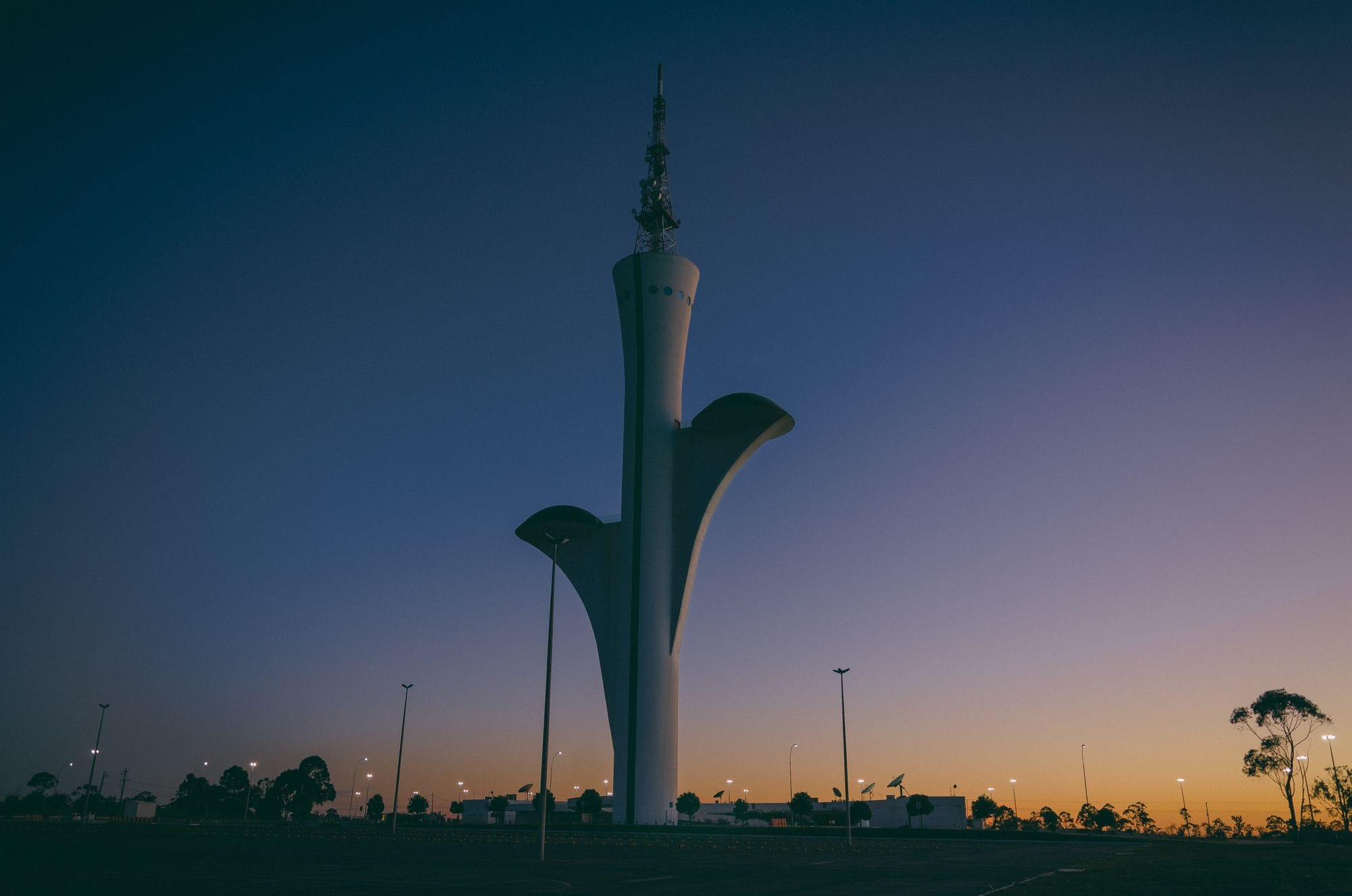 Stunning view of the Brasilia Digital TV Tower during a dramatic sunset in Brasília, Brazil.
