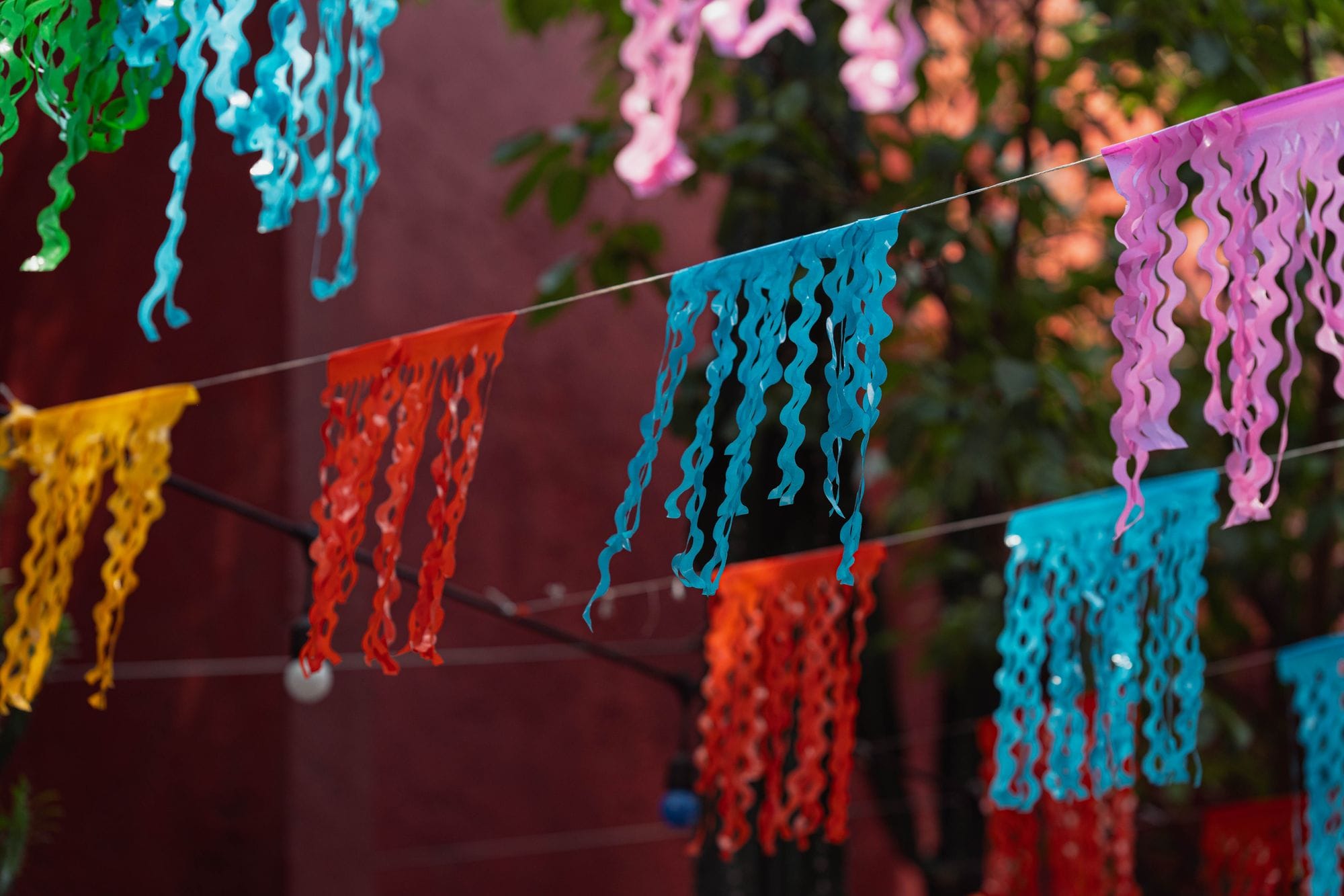 Vibrant festival banners hang on a street in Ciudad de México, CDMX, México.