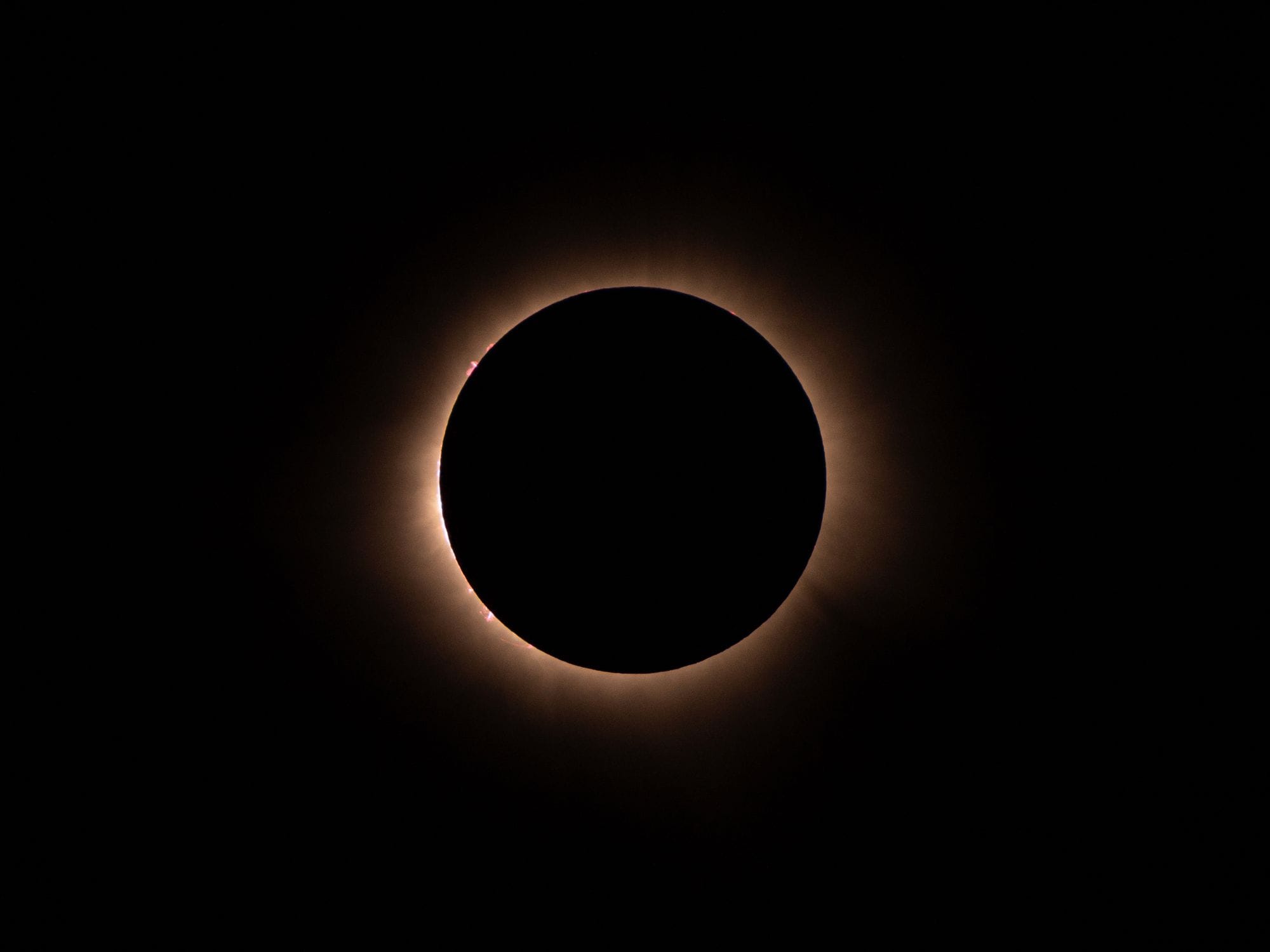 Stunning image of a total solar eclipse with glowing corona.