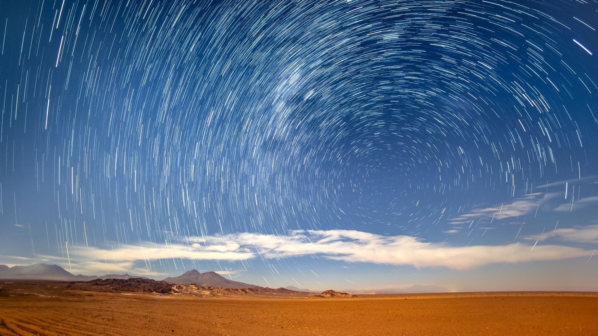 Stunning star trails over the Atacama Desert, capturing the vast night sky and serene landscape.