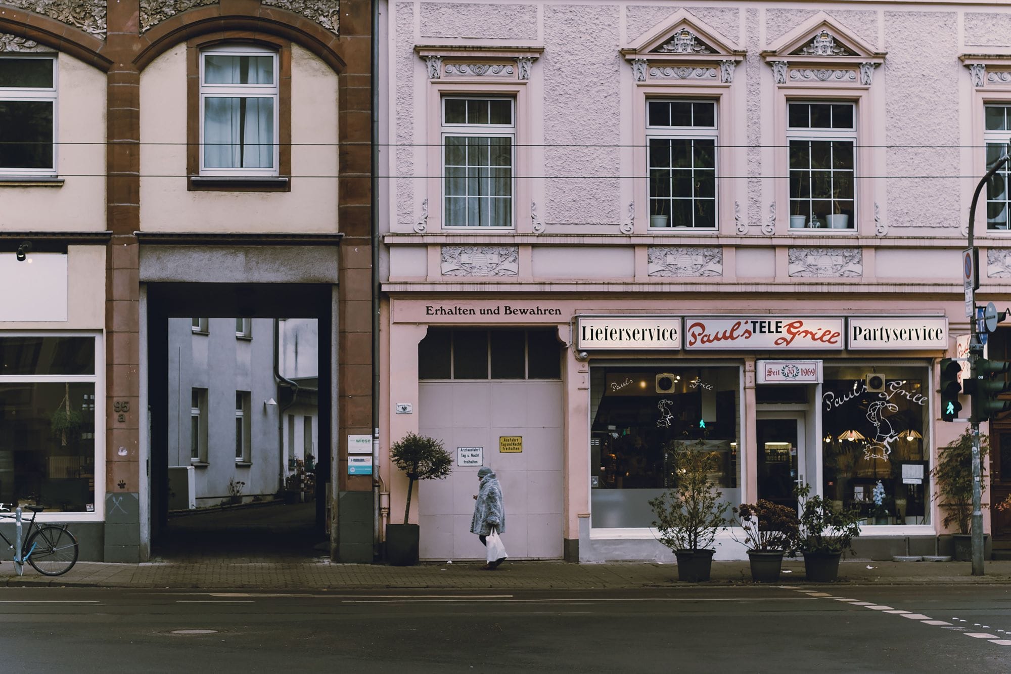 European building facade with restaurant, classic and urban street view.