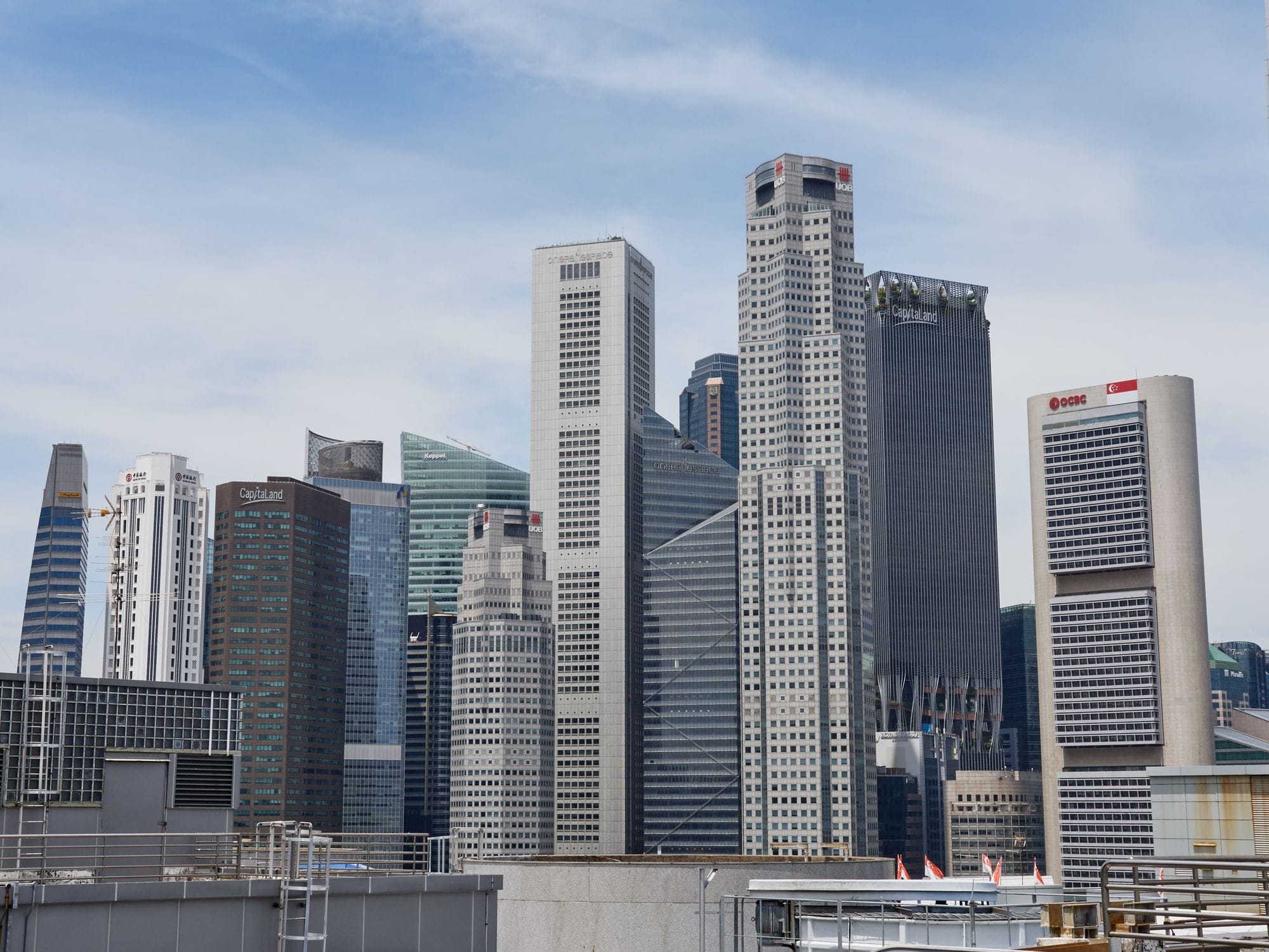 Stunning view of Singapore's modern skyline featuring iconic skyscrapers under a clear sky.