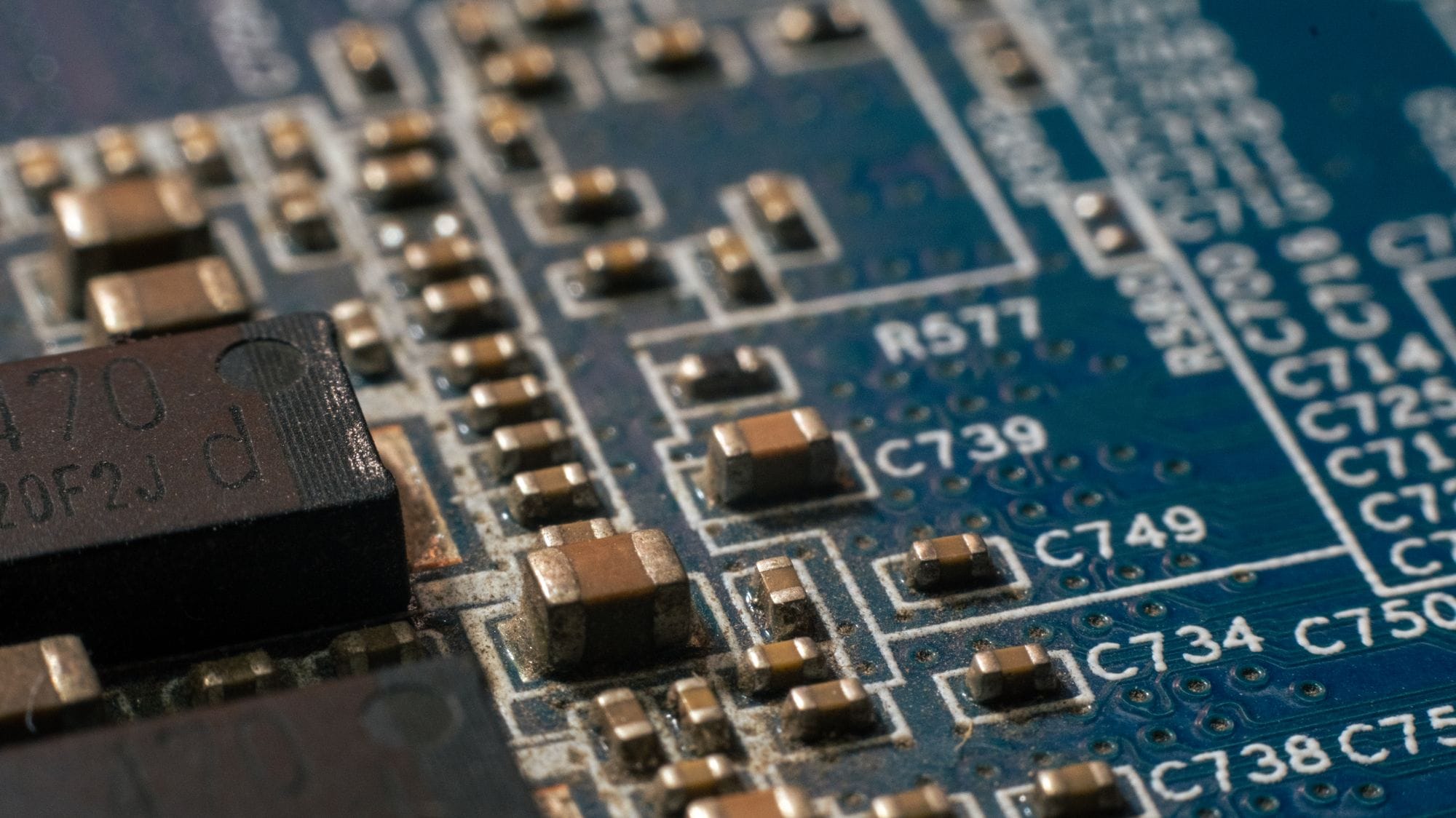 Detailed macro shot of a circuit board highlighting electronic components and traces.