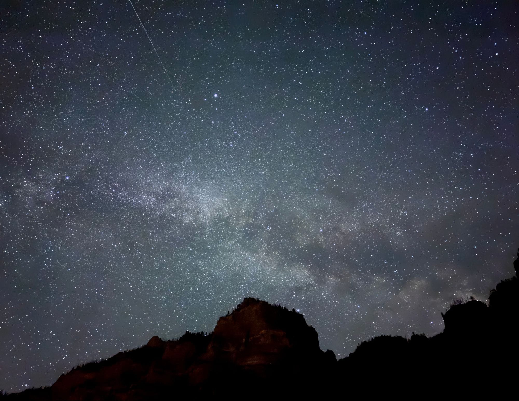 Beautiful starry sky over silhouettes of mountains in Glenwood Springs, Colorado.