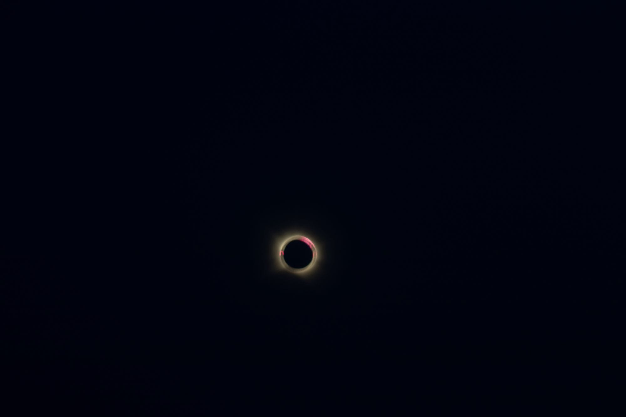 Captivating view of a total solar eclipse with a glowing corona set against a deep dark sky.