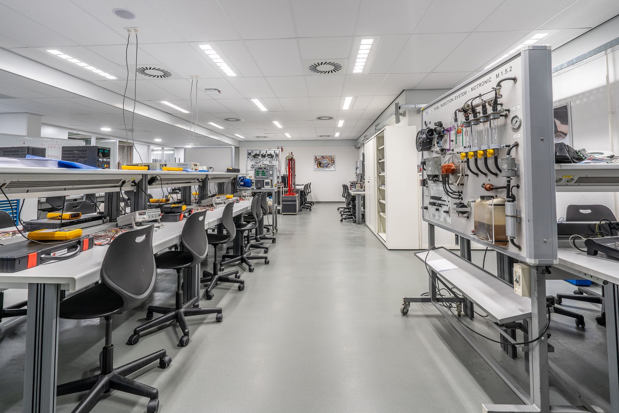 Spacious modern laboratory with workstations and equipment, ideal for scientific research and experiments.