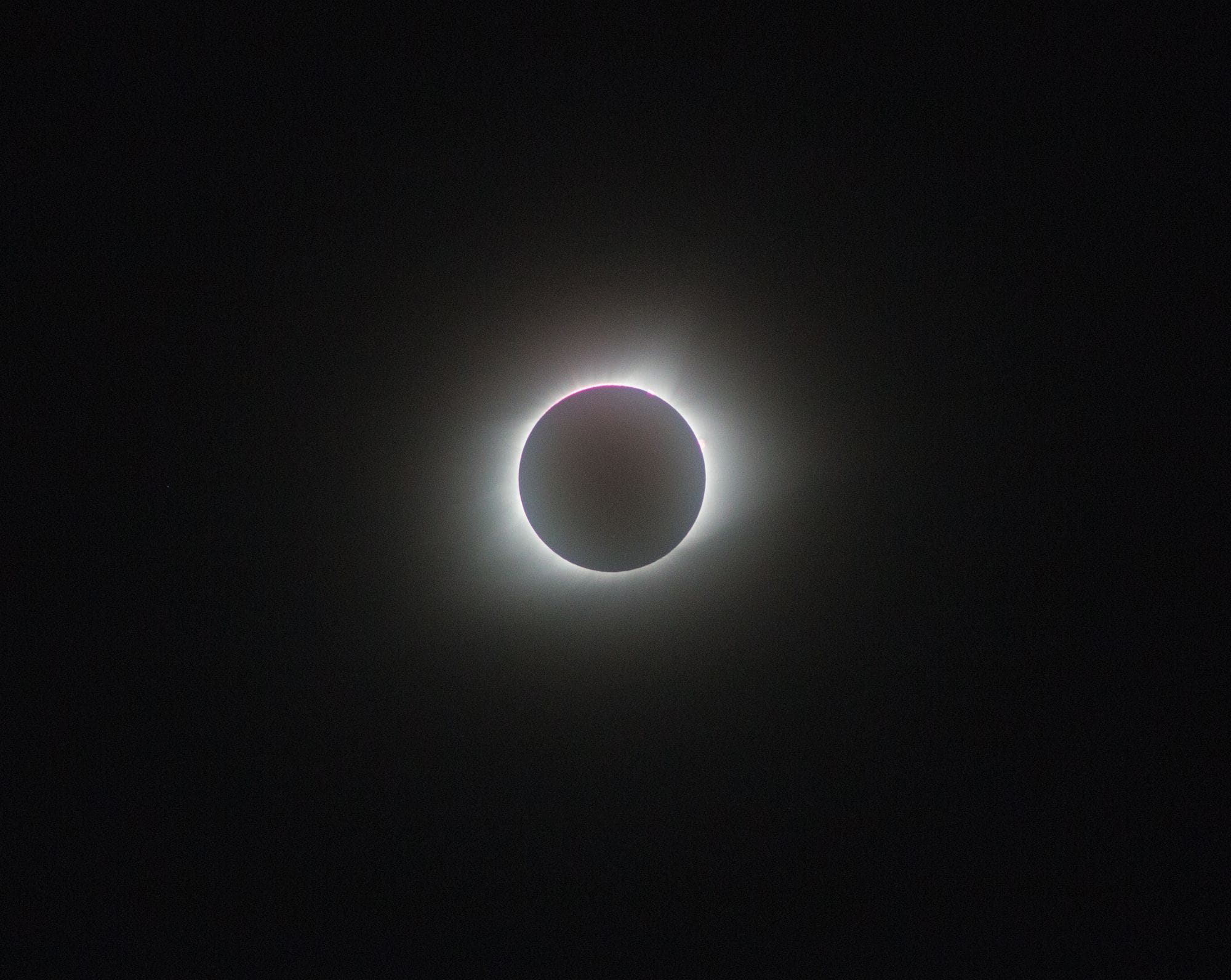 A breathtaking view of a full solar eclipse, showcasing the sun's corona.