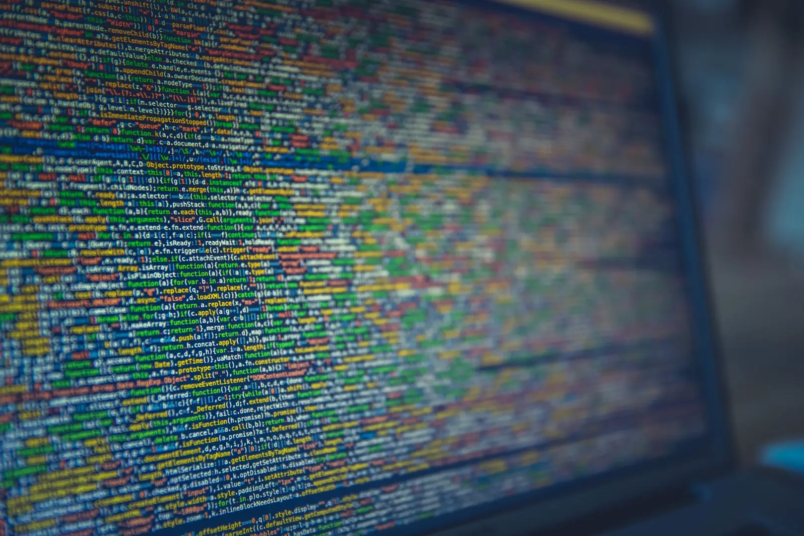 A detailed view of colorful source code displayed on a computer screen, representing modern programming and technology.