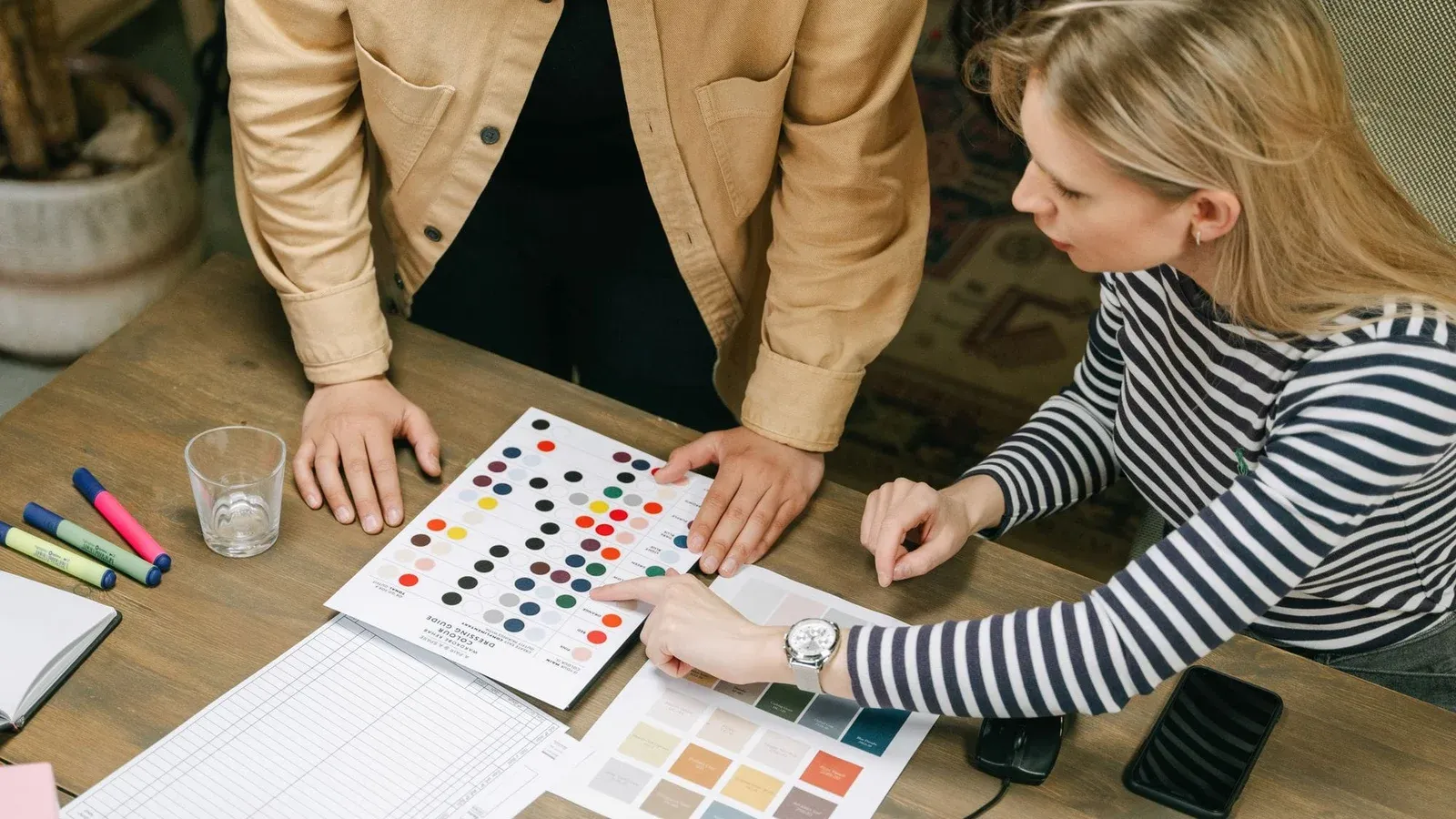 A collaborative team workspace focusing on planning using color charts and documents.
