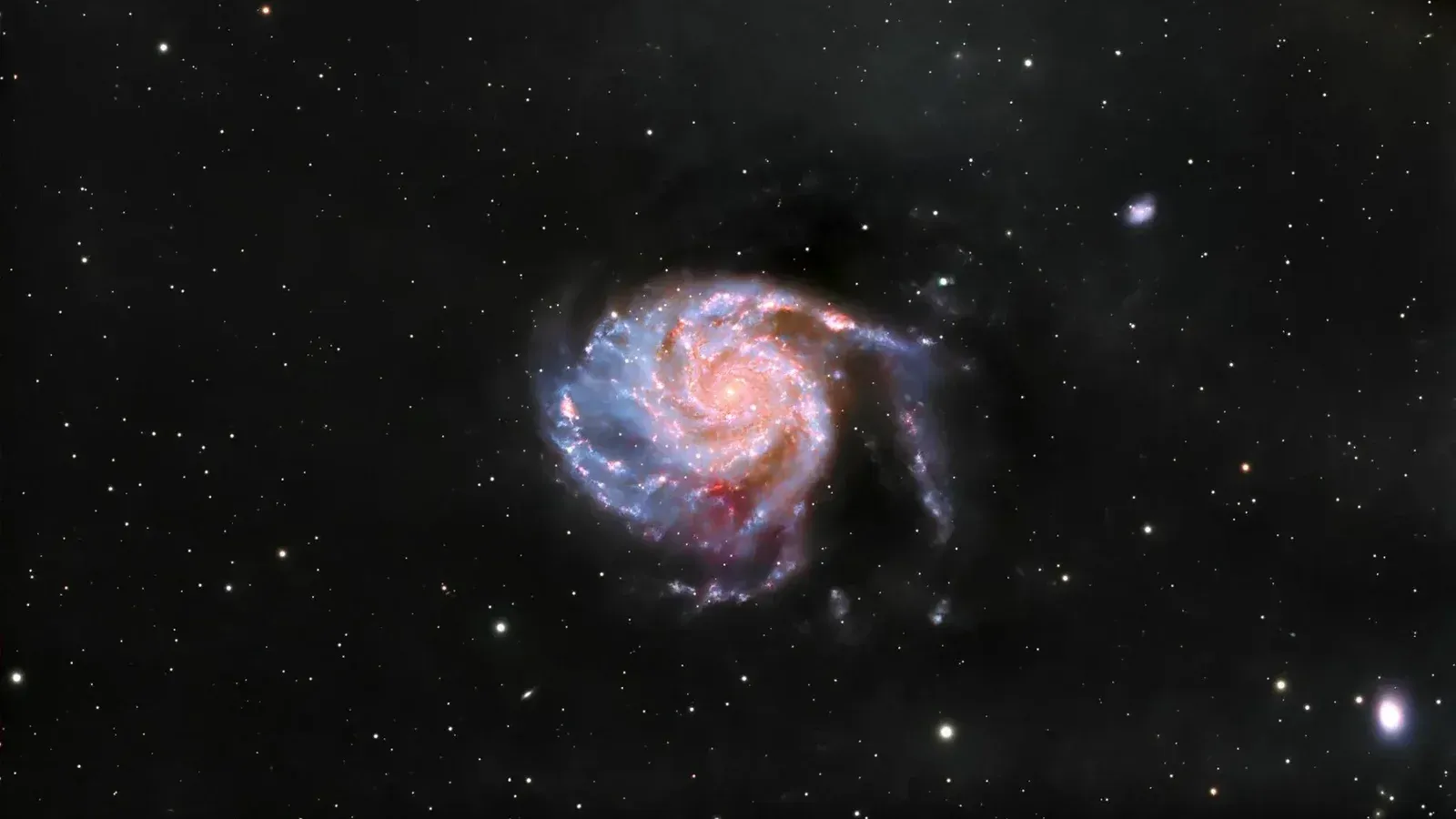 Captivating view of a spiral galaxy amidst stars in the vast universe.