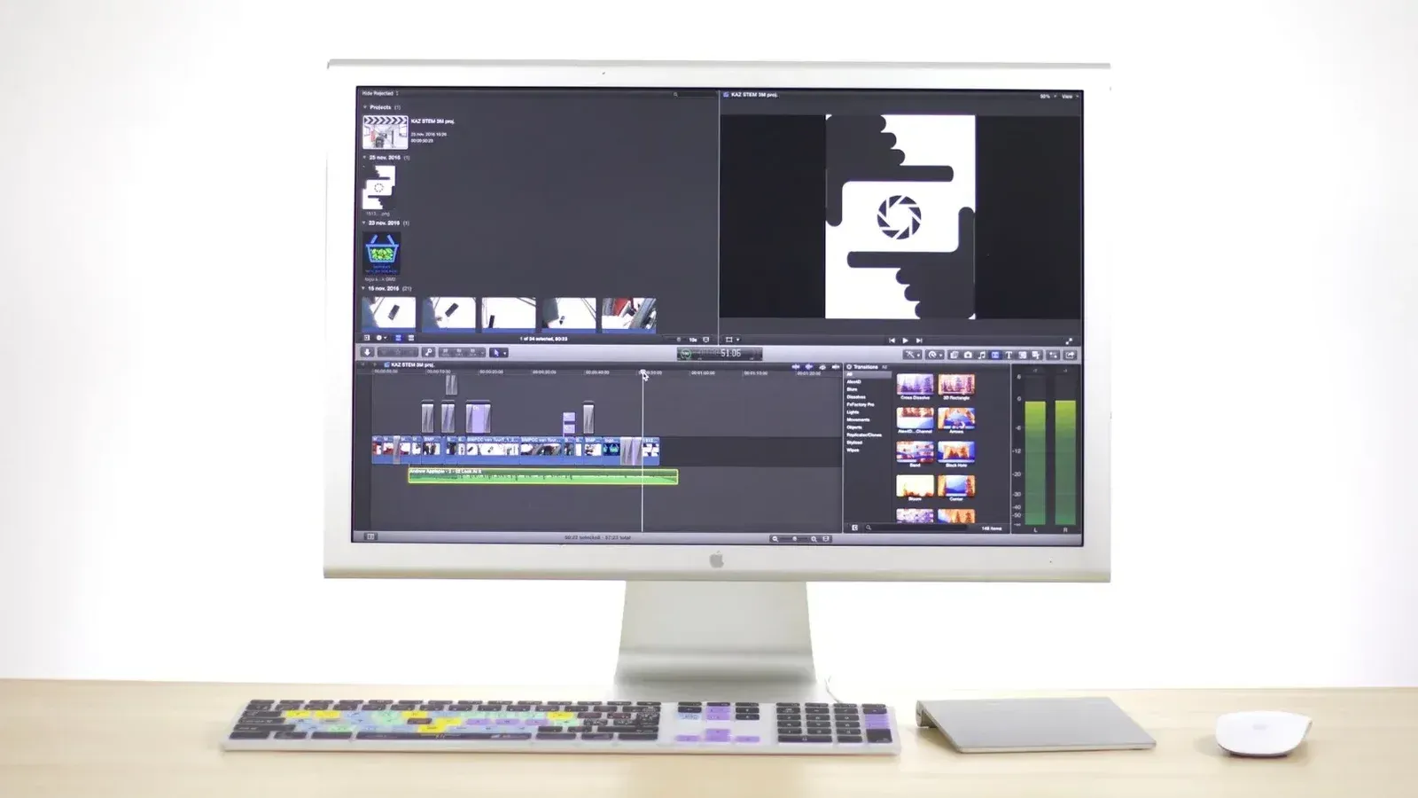A sleek computer monitor displays video editing software in a modern workspace.