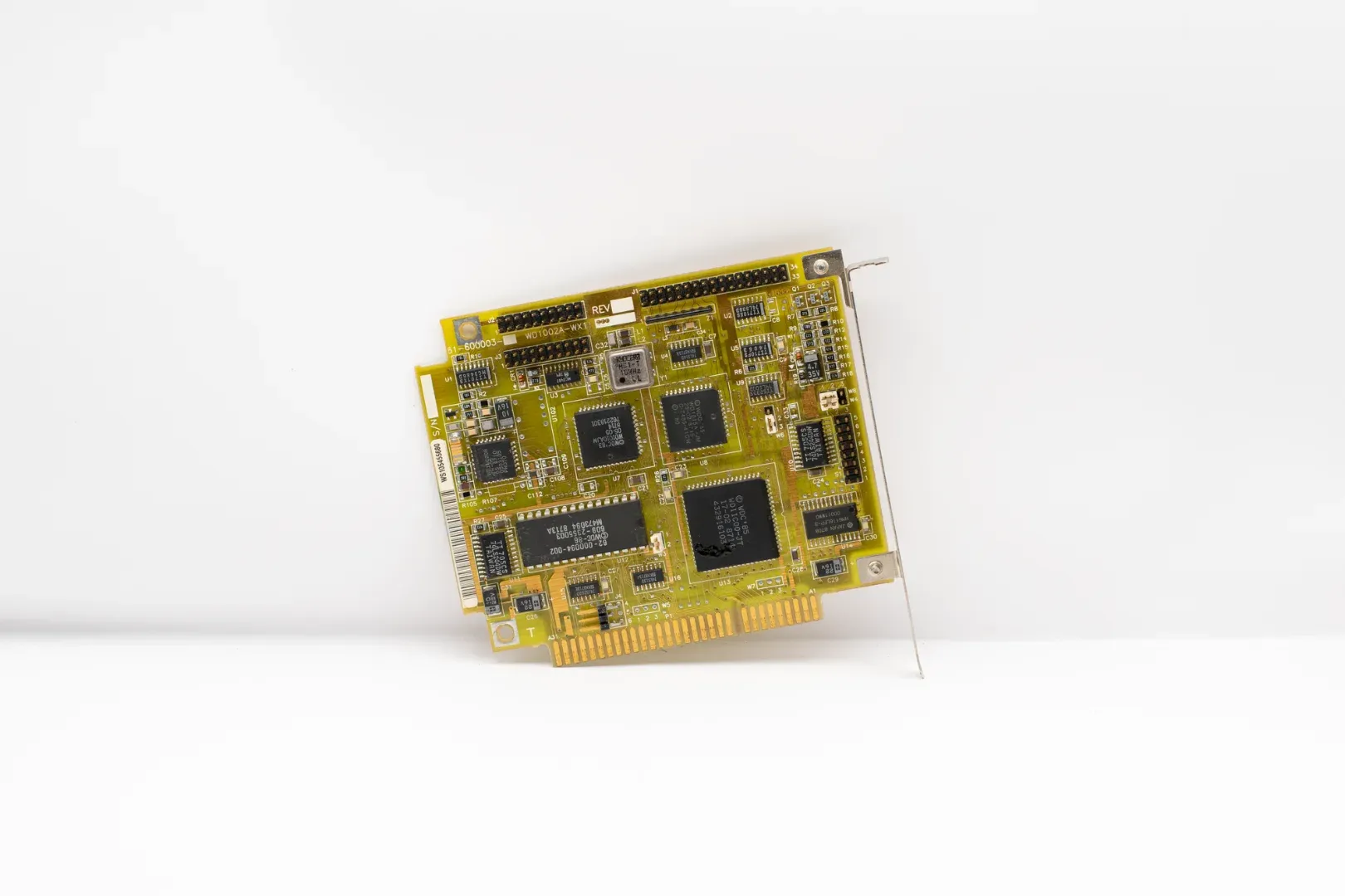 Antique circuit board showcasing vintage computing technology, isolated on a white background.