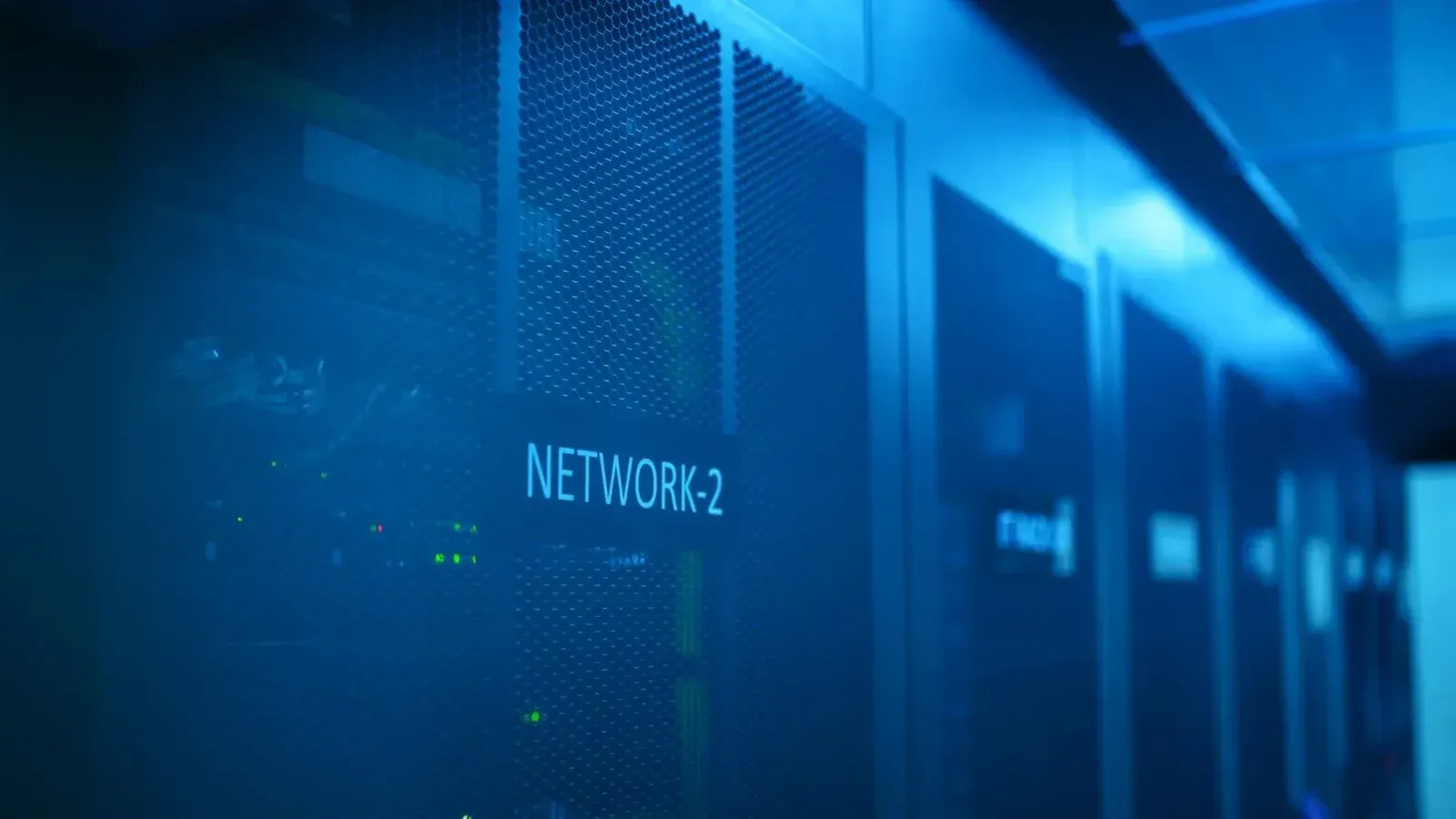 A modern server room featuring network equipment with blue illumination. Ideal for technology themes.