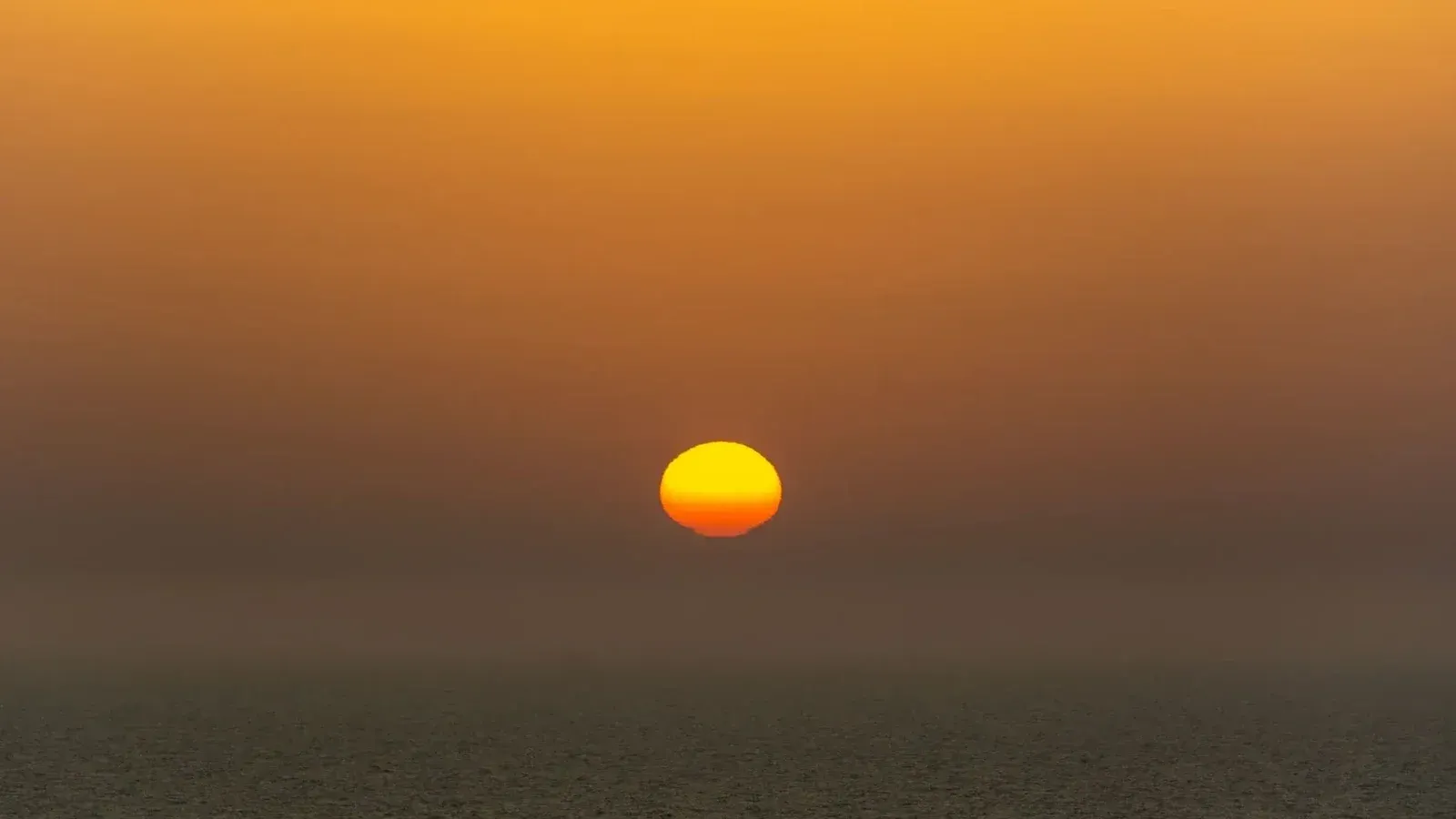 Captivating sunset with vibrant colors illuminating the ocean horizon.
