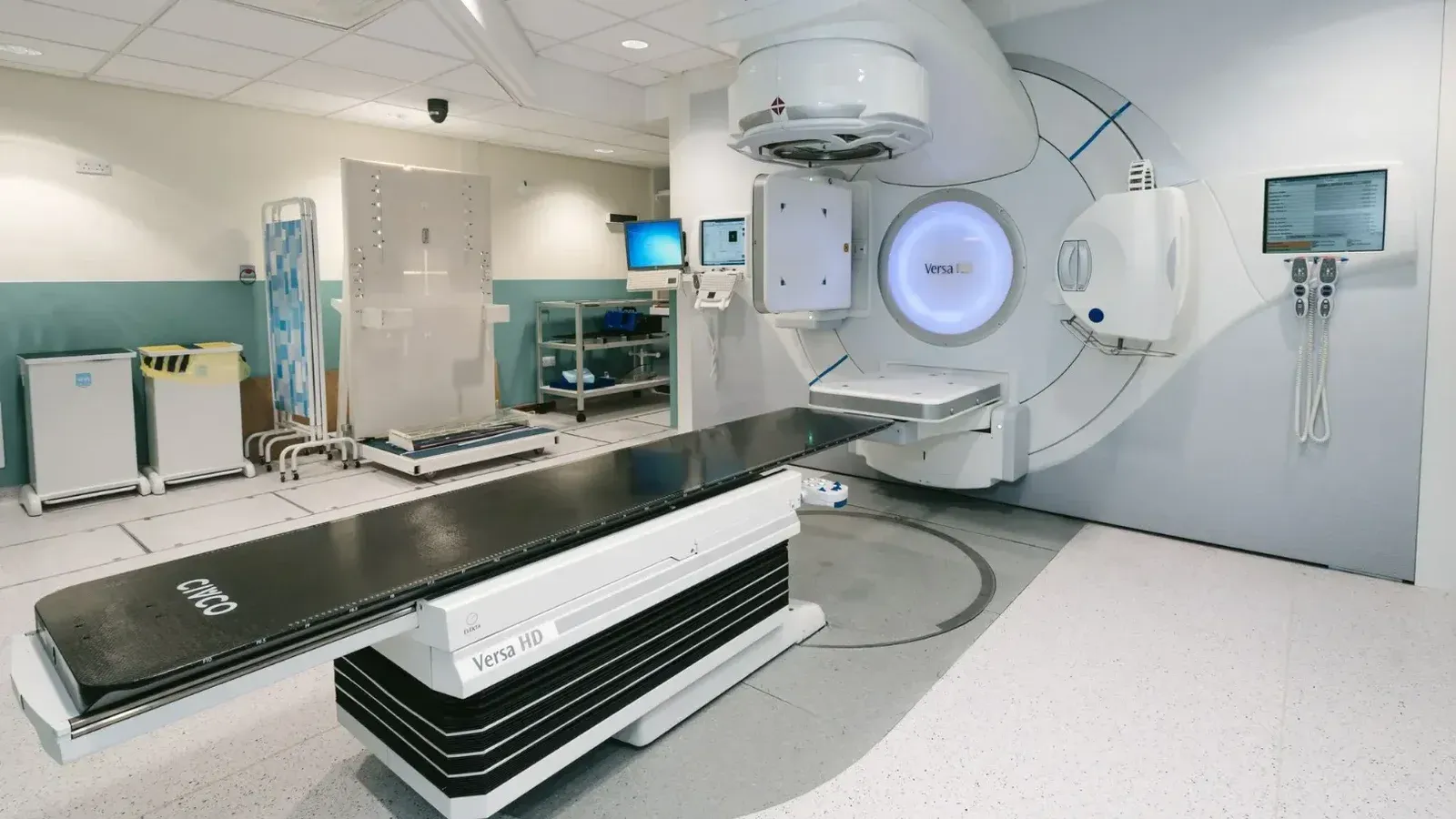 High-tech radiotherapy machine in a hospital's clinical setting for patient treatment.