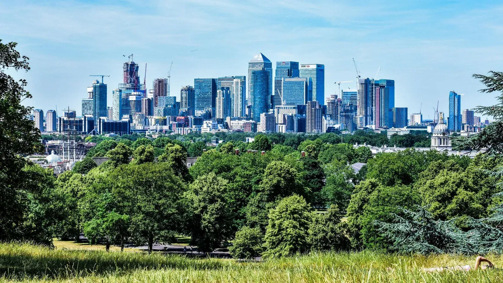 Stunning view of London skyline with greenery from Greenwich Park.