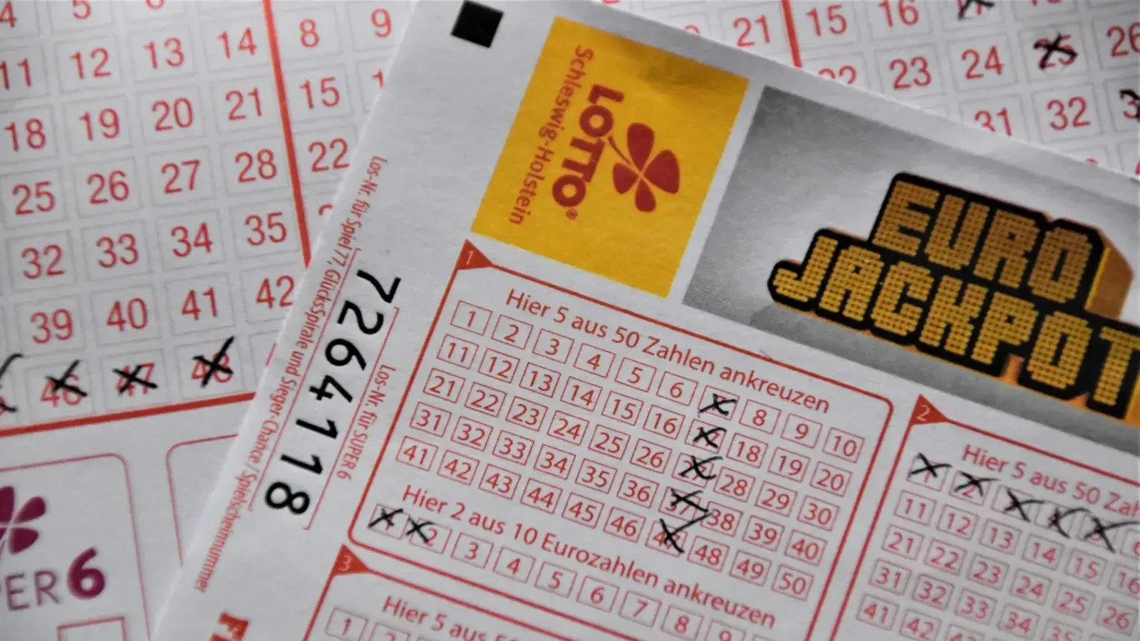 Detailed close-up of a EuroJackpot lottery ticket with selected numbers in focus.