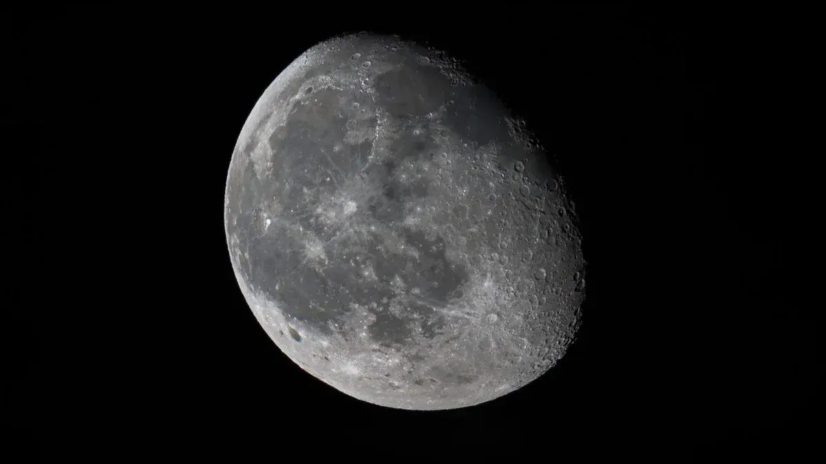 Detailed view of the moon's surface against a dark sky, captured in Florida.