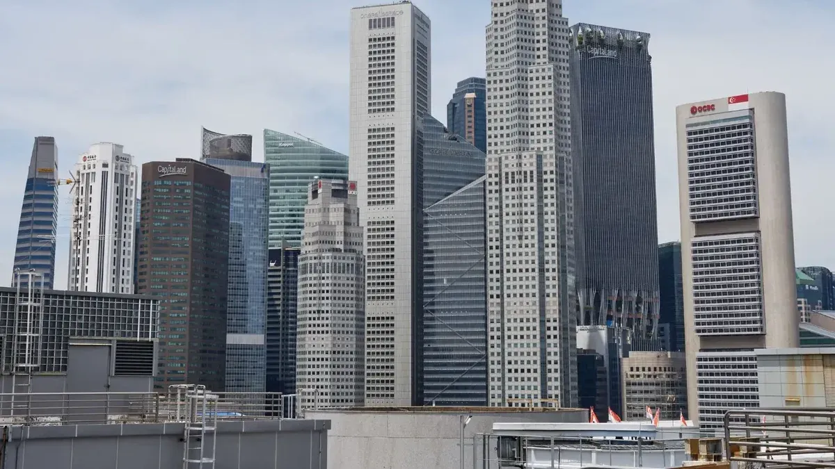 Stunning view of Singapore's modern skyline featuring iconic skyscrapers under a clear sky.