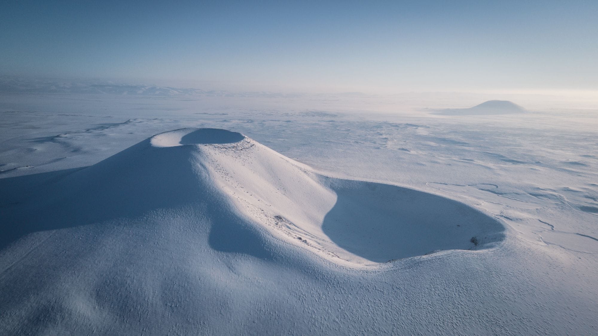 A breathtaking aerial view of a snow-covered volcanic crater in Konya, Türkiye.