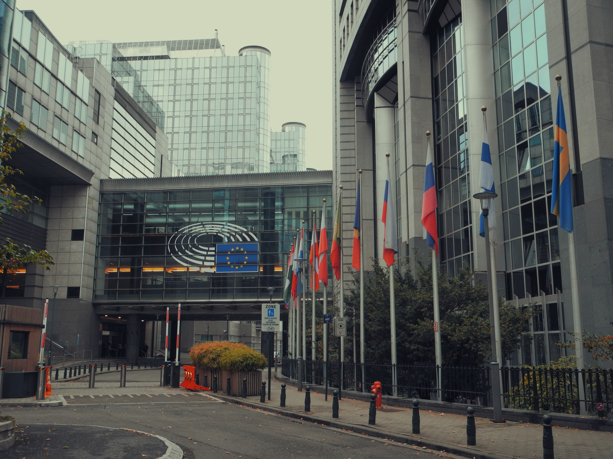 Exterior view of European Parliament with EU flags in Brussels