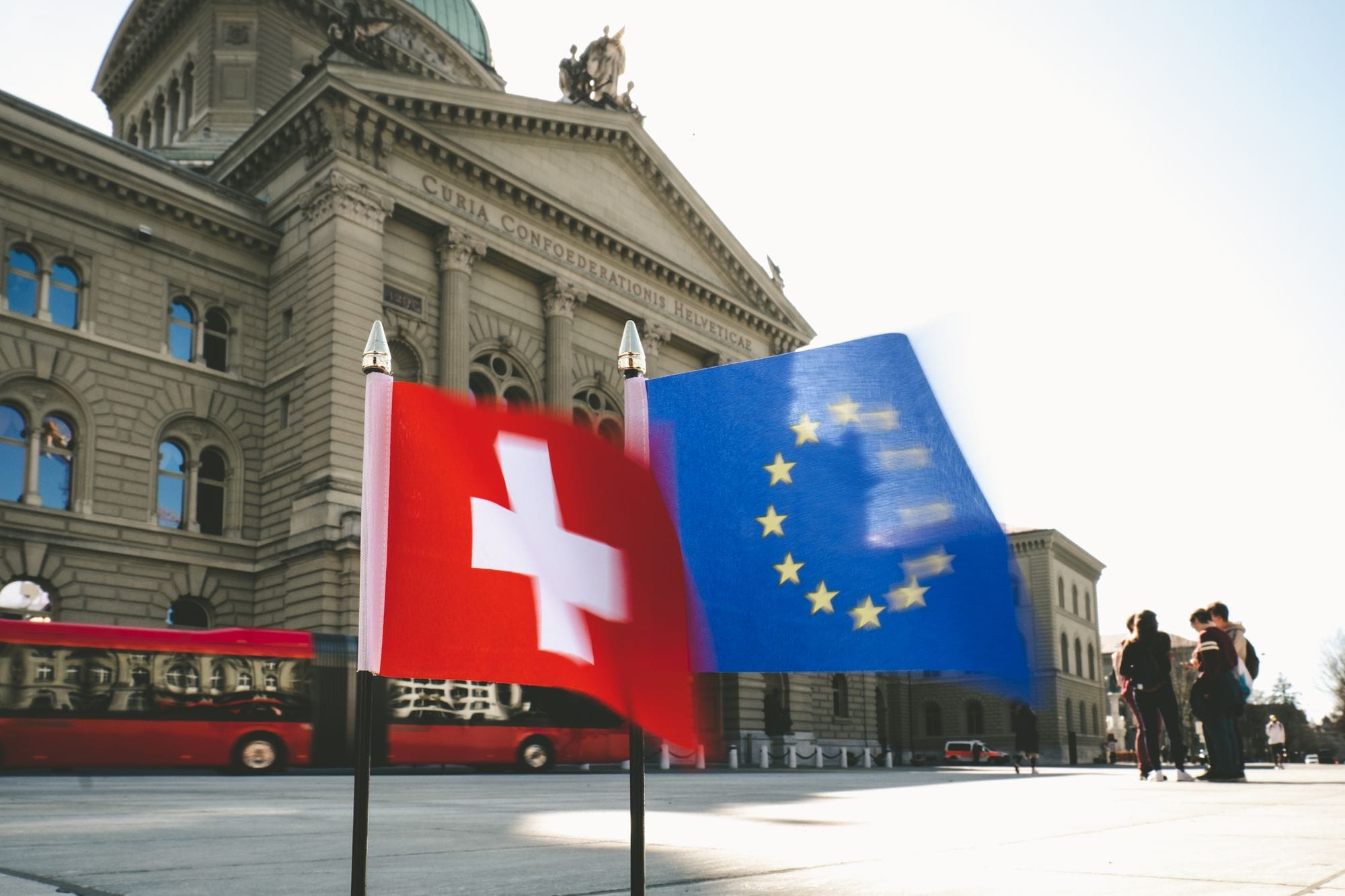 Flags of Switzerland and the EU flutter before the Swiss Federal Palace in Bern.