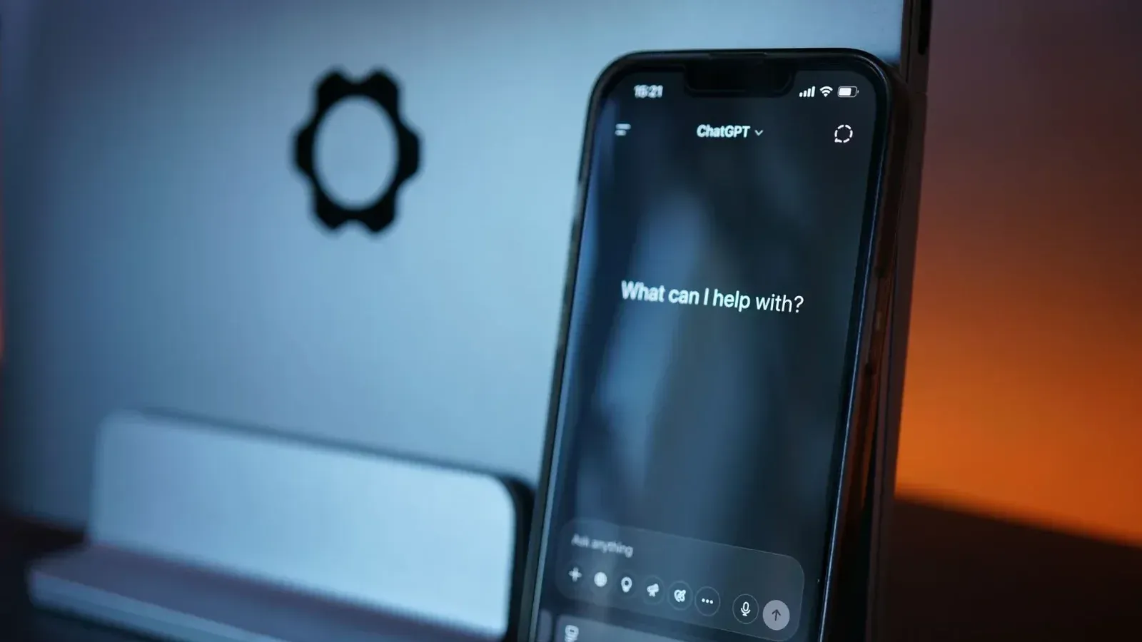 Close-up of a smartphone with AI chat interface, showcasing advanced technology in a sleek design.