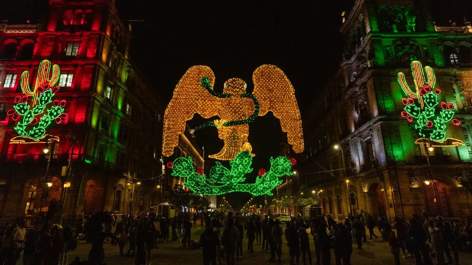 Nighttime scene of vibrant LED display celebrating Mexico's Independence in Zocalo, CDMX.