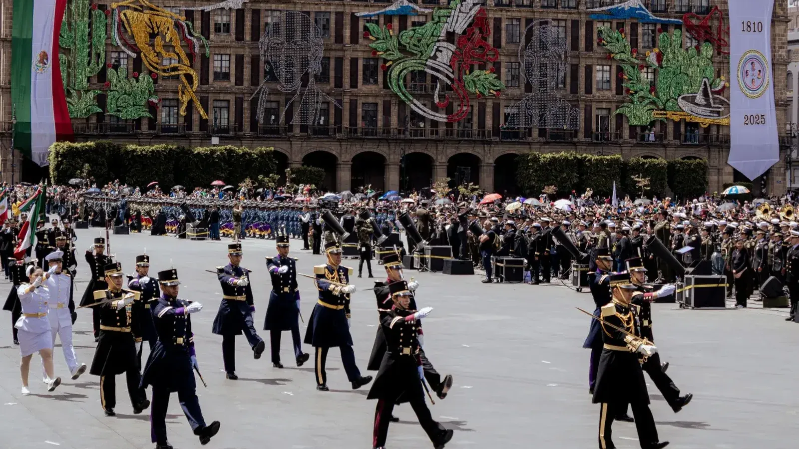 Colorful military parade in Zócalo Square, Mexico City, celebrating national pride.