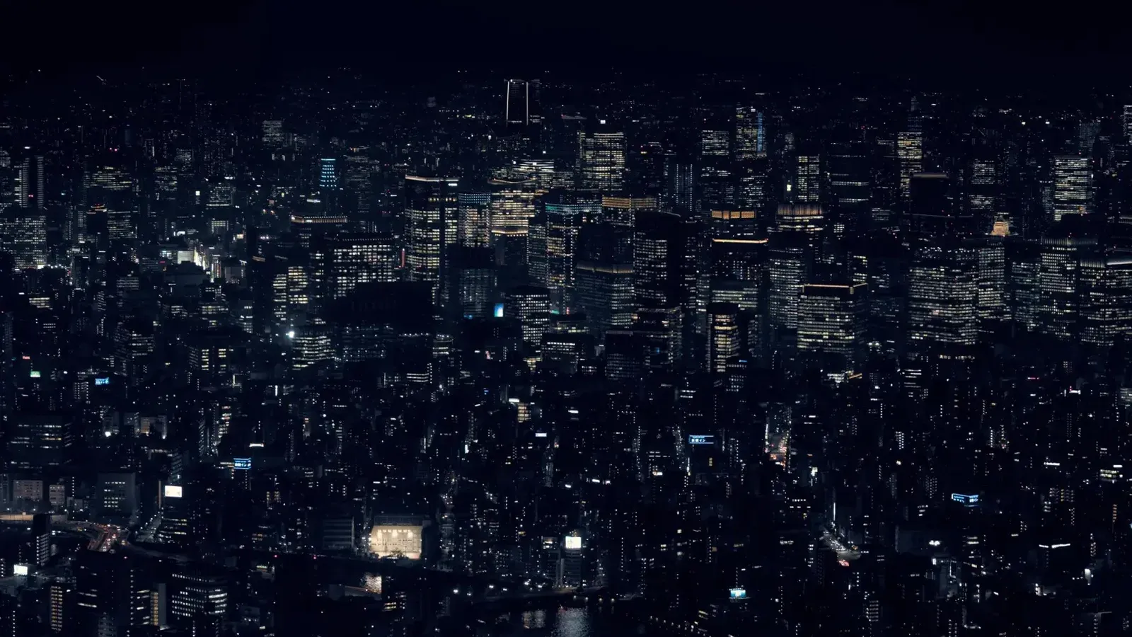 A stunning view of Tokyo's cityscape with illuminated skyscrapers at night, showcasing urban life in Japan.