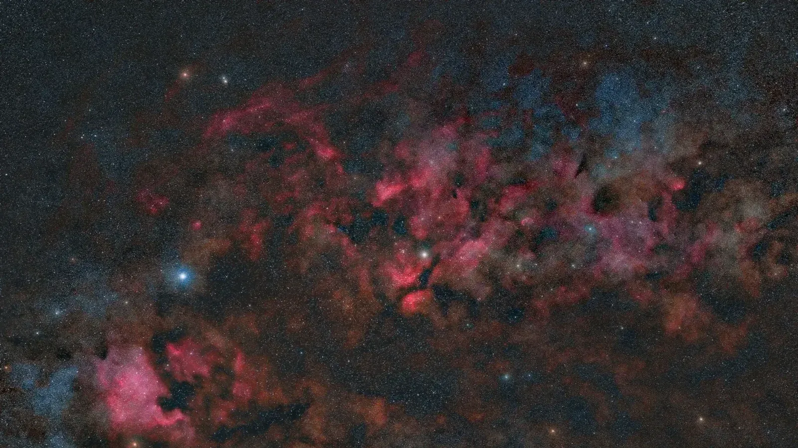 A breathtaking view of a nebula with vibrant colors and distant stars in the cosmos.