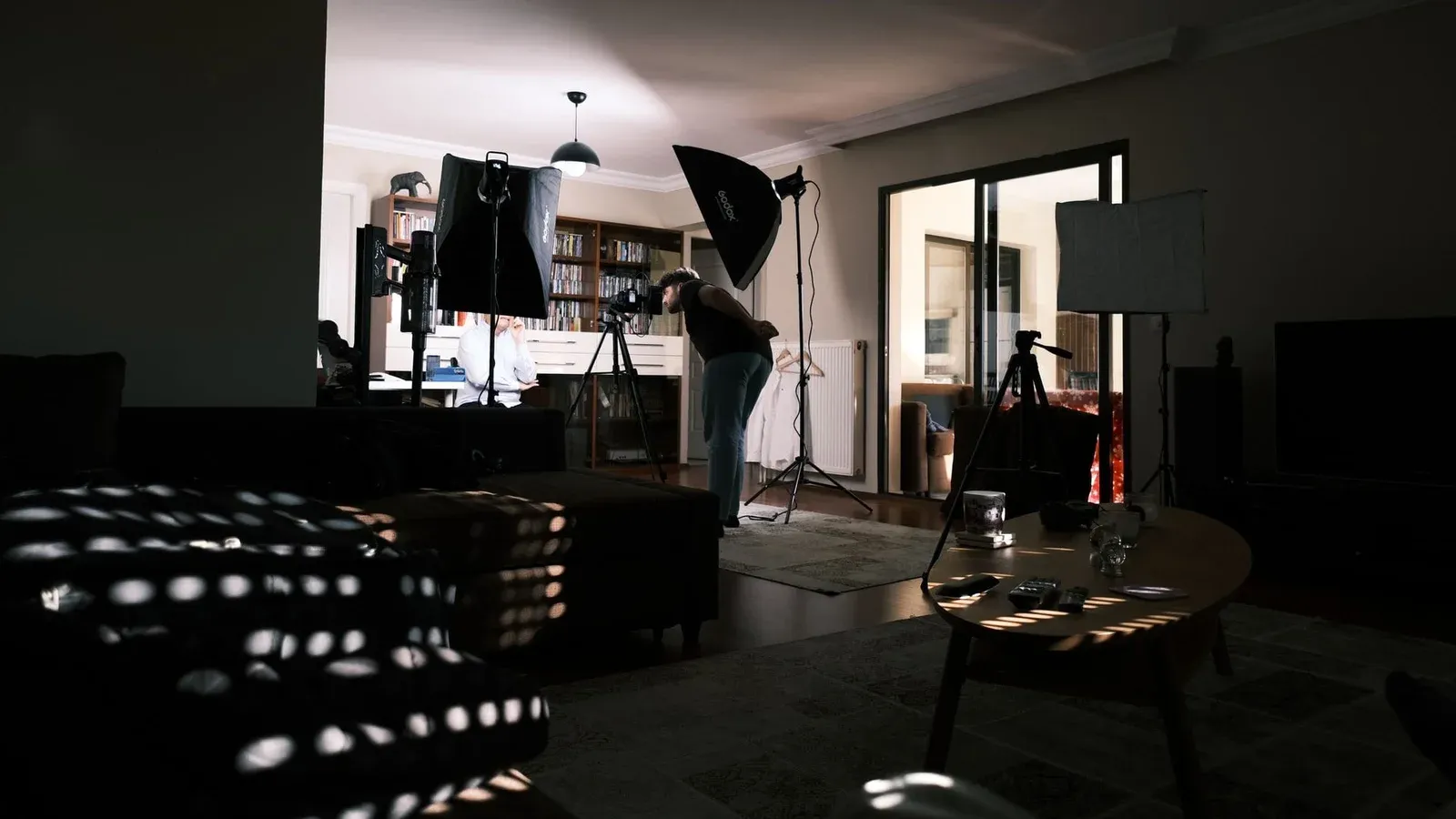 A cozy home studio with professional lighting equipment for a photo session.