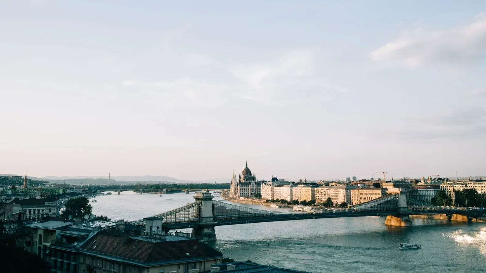 A picturesque view of Budapest featuring the Chain Bridge and Hungarian Parliament along the Danube River.