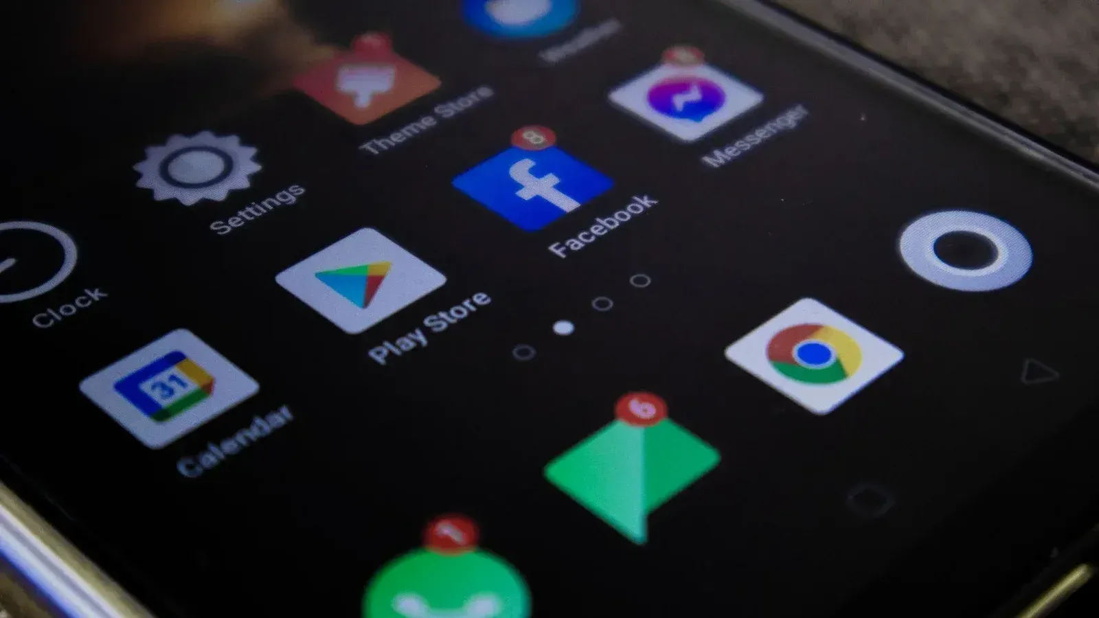 Detailed view of a smartphone screen with popular app icons including Facebook and Messenger.