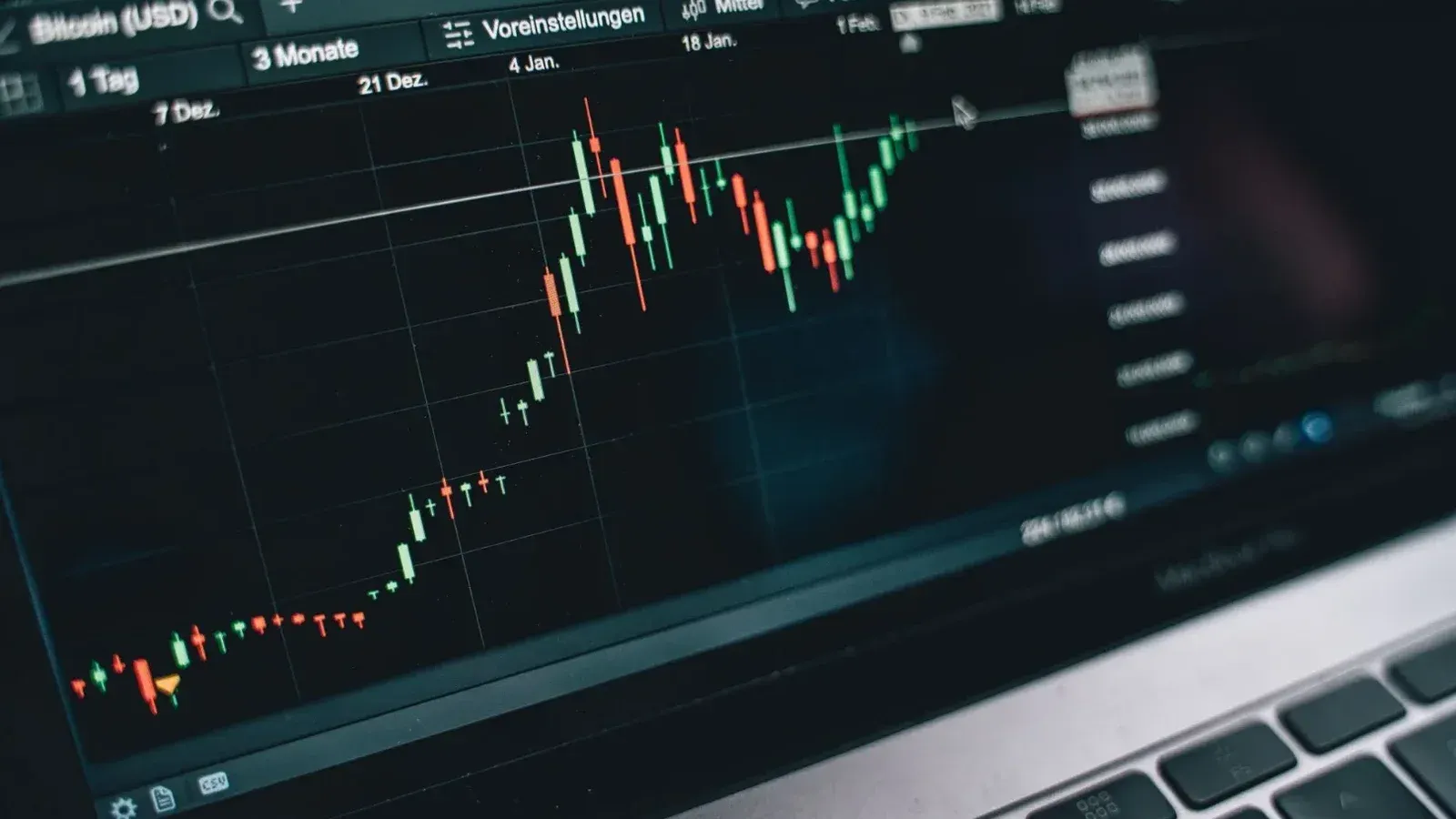 Close-up of a computer screen displaying cryptocurrency market trends and data.