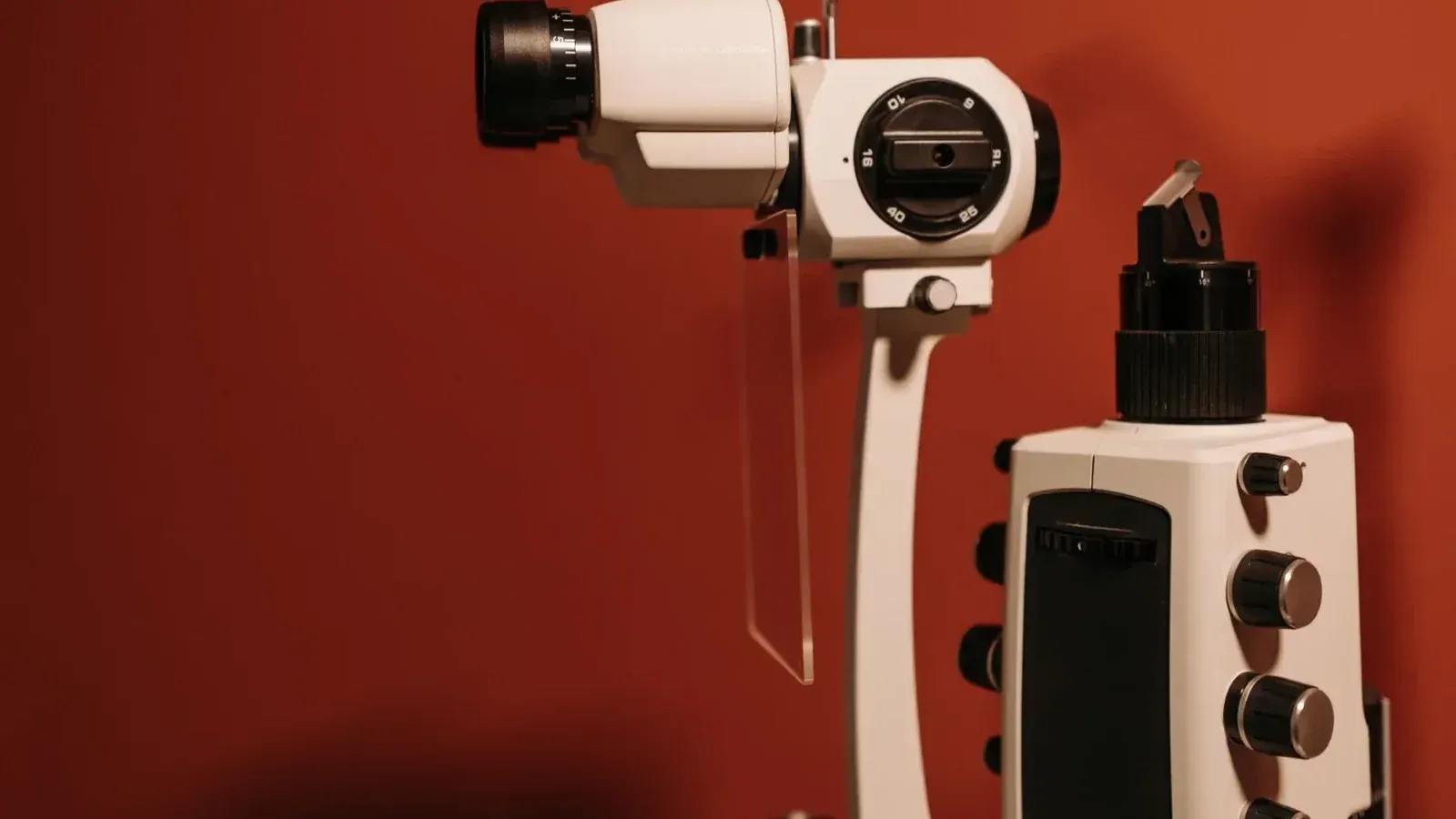 High-quality slit lamp microscope used in ophthalmology for eye examinations, captured indoors.