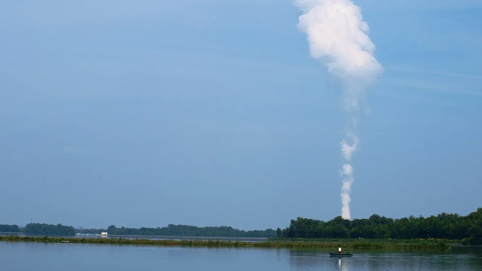 Isar Nuclear Power Plant from across lake showing cooling tower plume