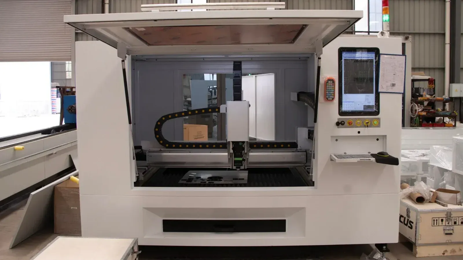 Modern CNC machine in a factory, showcasing advanced industrial automation technology.