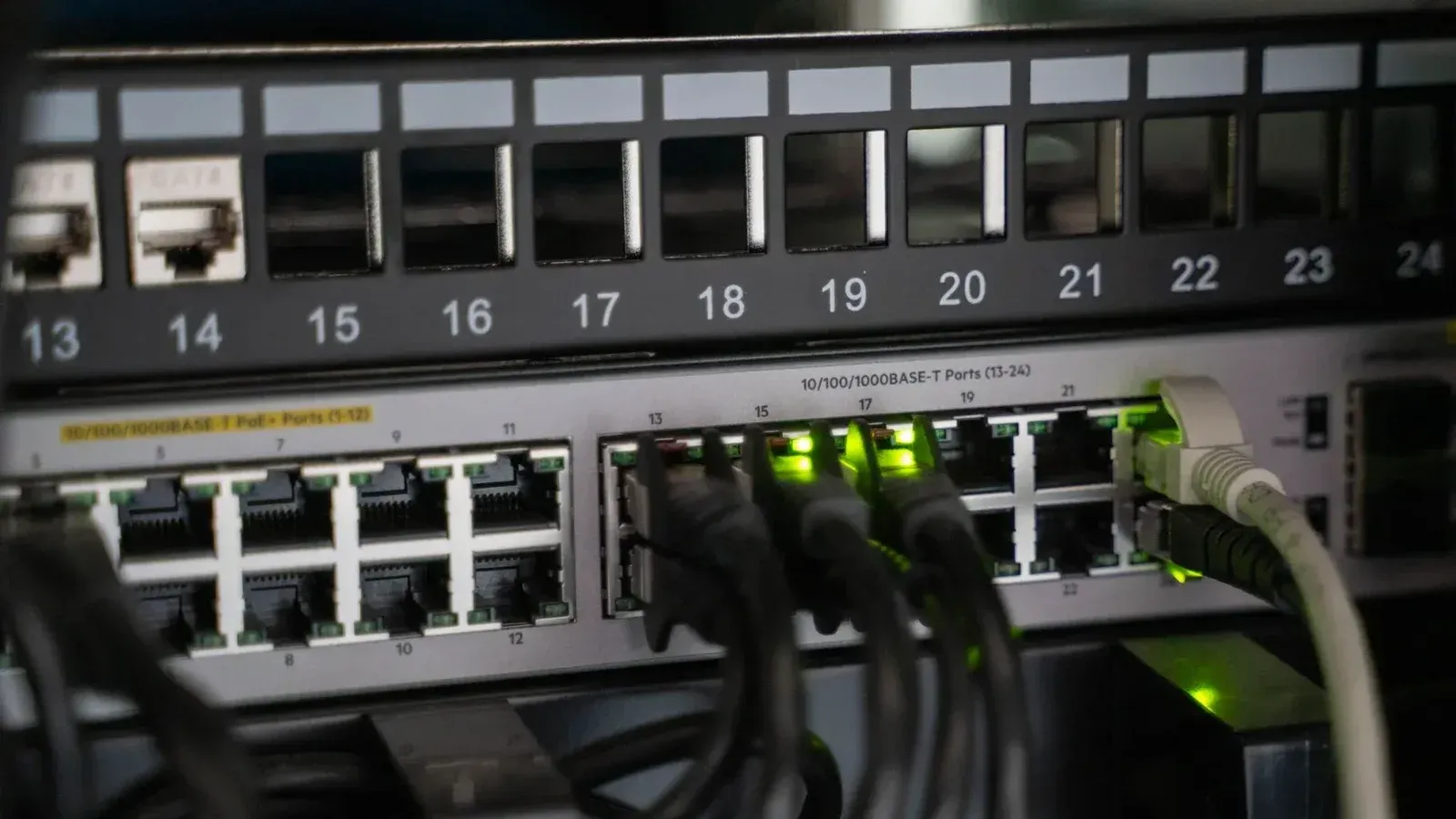Networking equipment with connected cables, showcasing modern technology infrastructure.