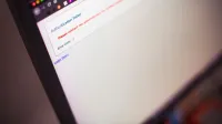 Close-up of a computer screen displaying an authentication failed message.
