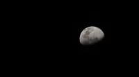 A crescent moon captured in detail against a dark night sky.