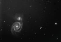 A captivating black and white image of a spiral galaxy in the expansive cosmos.