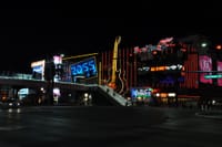 Night view of the vibrant Las Vegas Strip with neon lights and iconic landmarks.