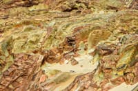 Vivid rock formations displaying erosion patterns and natural textures in an outdoor setting.
