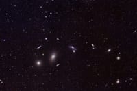 Captivating image of distant galaxies and star clusters in the vast universe. Perfect for astronomy enthusiasts.