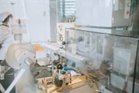 Close-up of advanced machinery in a modern laboratory setting, highlighting technology and industry.