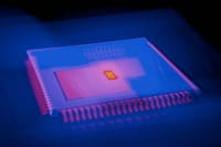Blurred abstract image of a microchip with heatmap colors highlighting technological innovation.